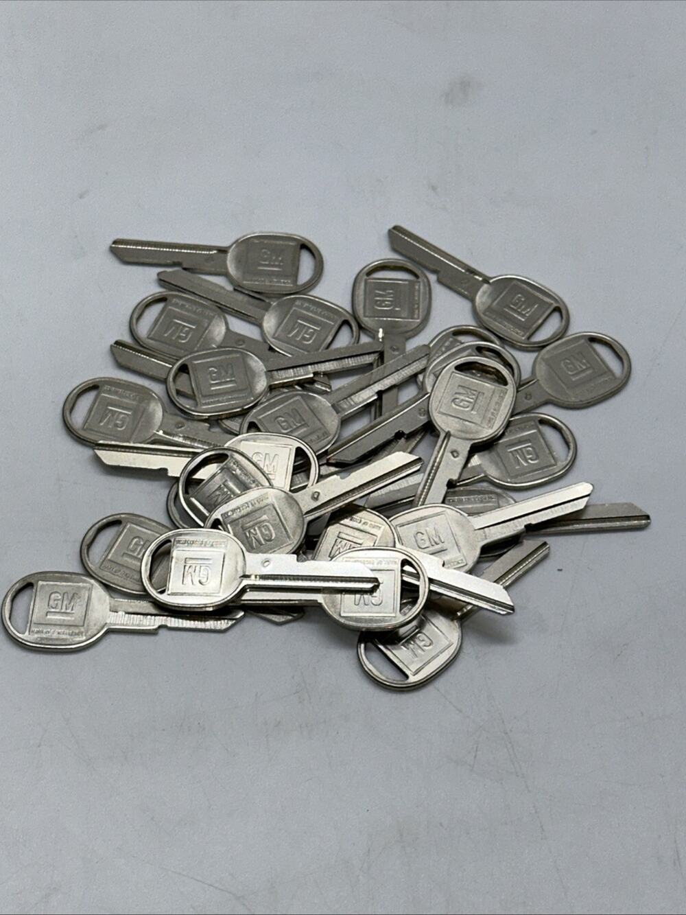 27 NEW GM Logo OEM Door "D” Key Blank Uncut 320653 Strattec original